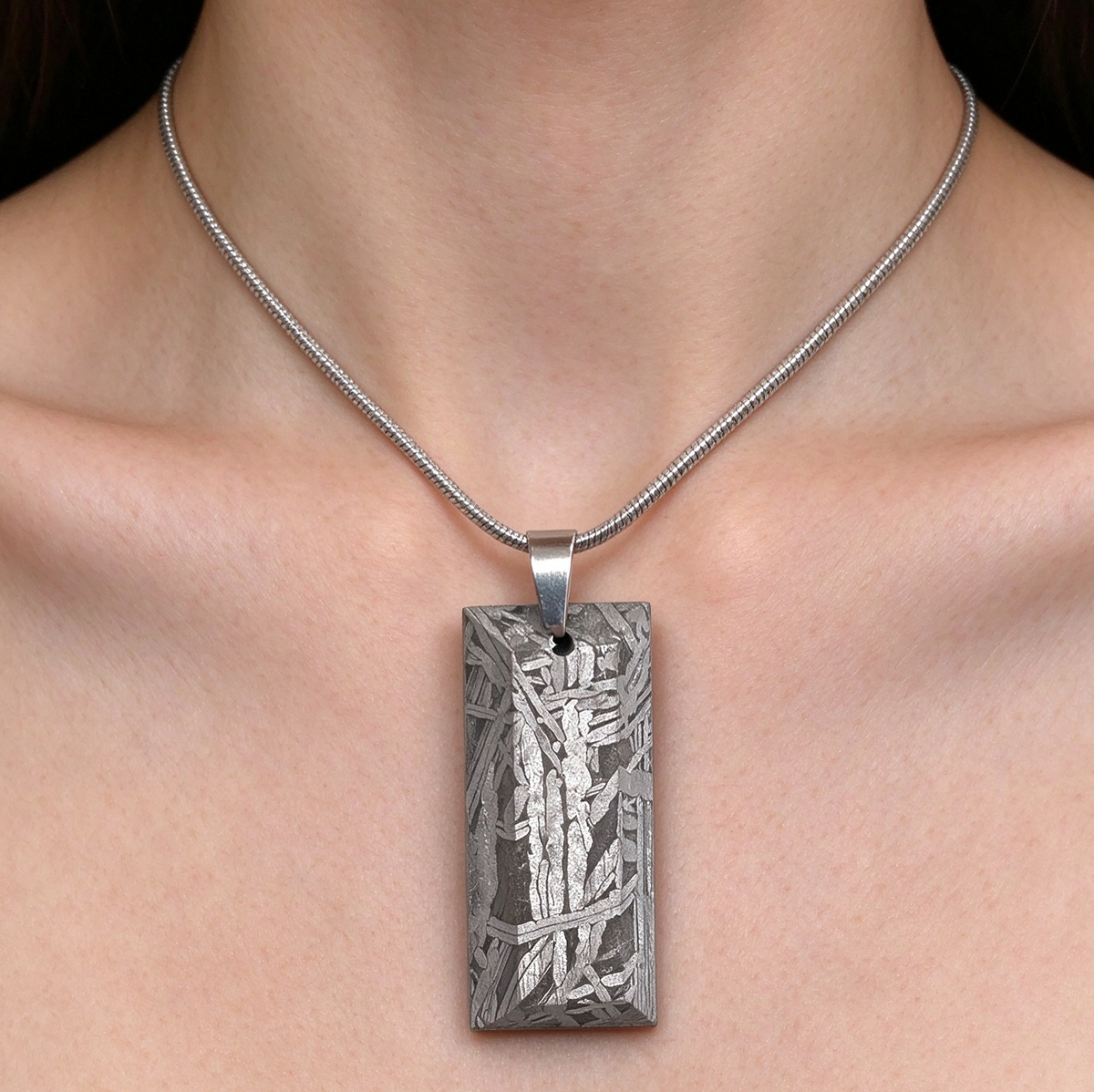 Muonionalusta meteorite pendant with naturally etched iron sample pattern