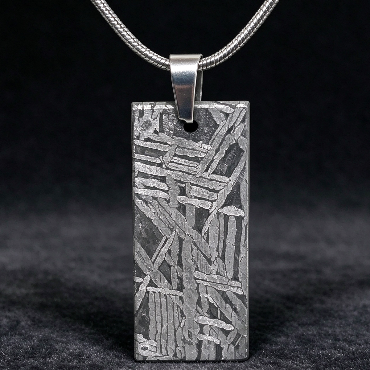 Muonionalusta meteorite pendant with naturally etched iron sample pattern