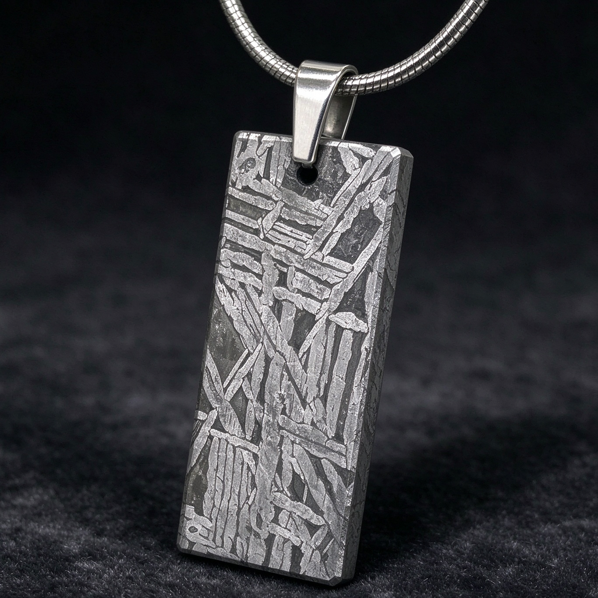 Muonionalusta meteorite pendant with naturally etched iron sample pattern