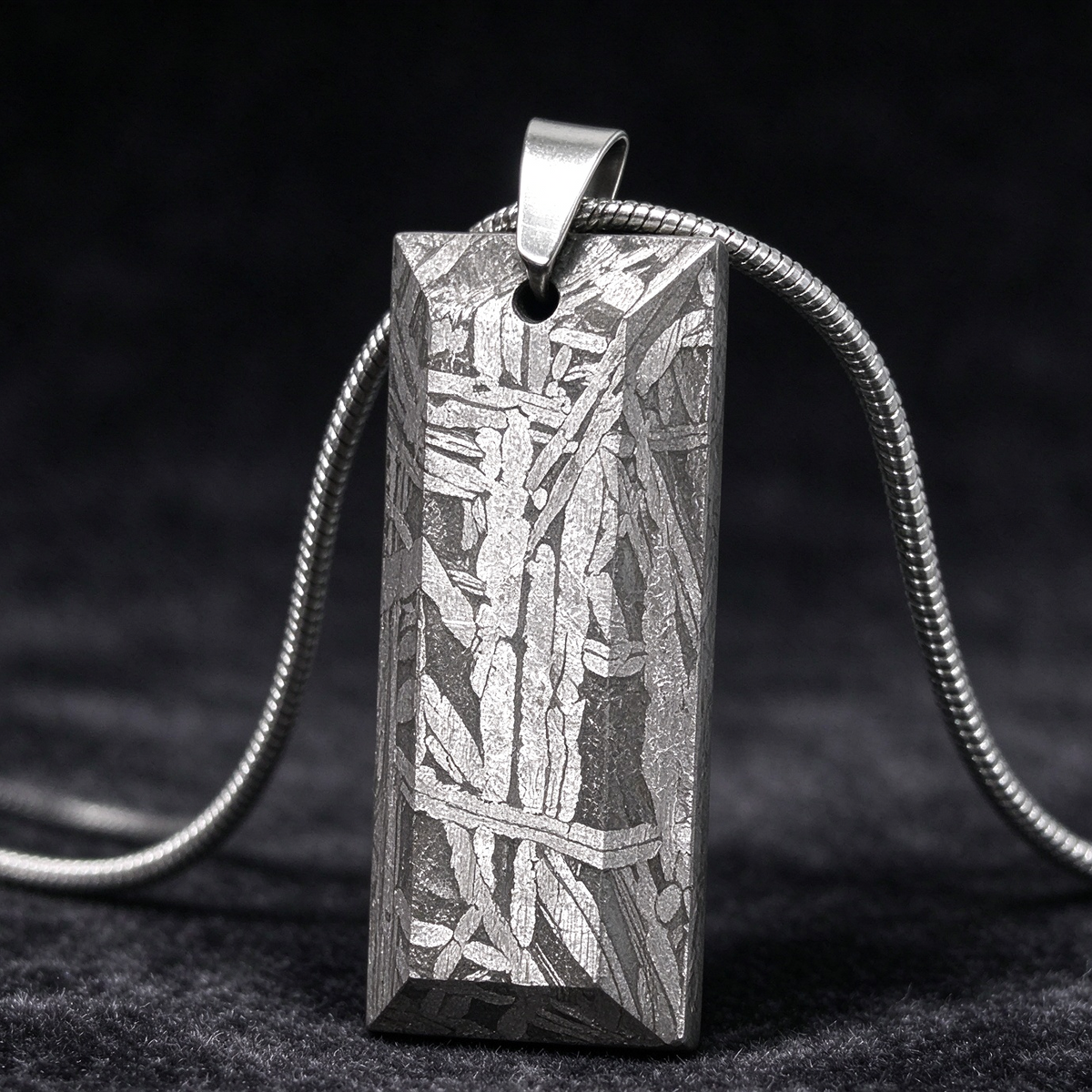 Muonionalusta meteorite pendant with naturally etched iron sample pattern