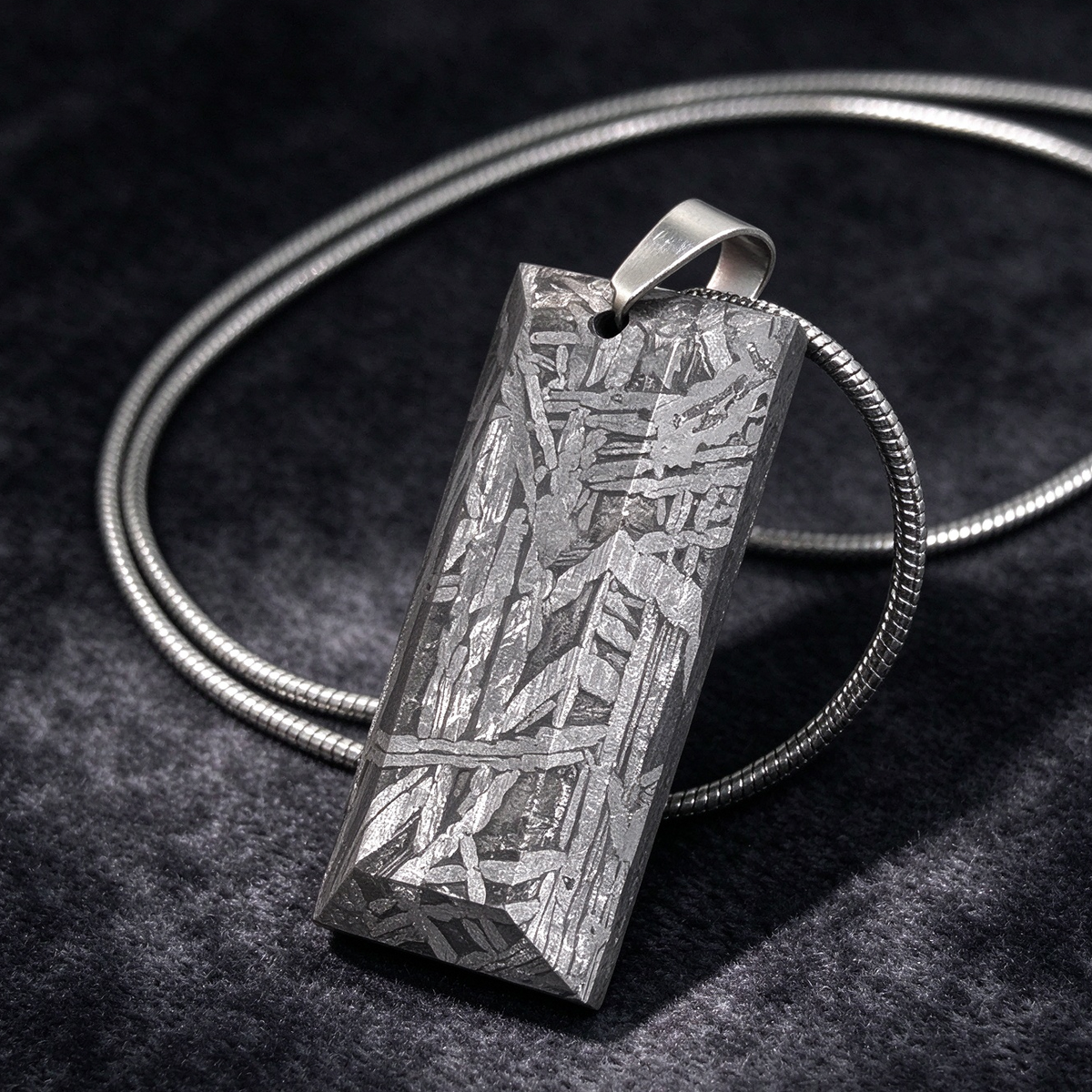 Muonionalusta meteorite pendant with naturally etched iron sample pattern